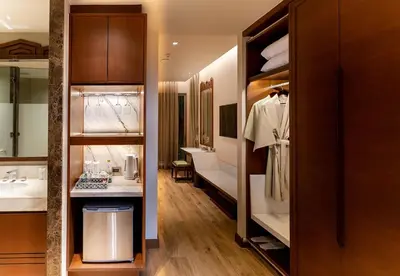 a dressing room with a sink and a mirror at W1Bangkoknoi Hotel in Nonthaburi