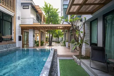 a swimming pool in the backyard of a house at SHAN Villas Sukhumvit ฌานวิลล่า สุขุมวิท in Bangkok