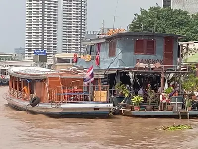 a ferry boat on the water in a river at Sabai Sabai Liveaboard Bangkok in Bangkok