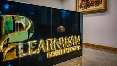 a sign for the denver broncos on a wall at Plearnwan Deluxe Mansion in Bangkok