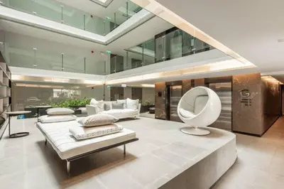a large living room with a couch and a chair at Circle Rein Sukhumvit 12 #1BR#Pool&Gym#Near Terminal 21#Max2 in Bangkok