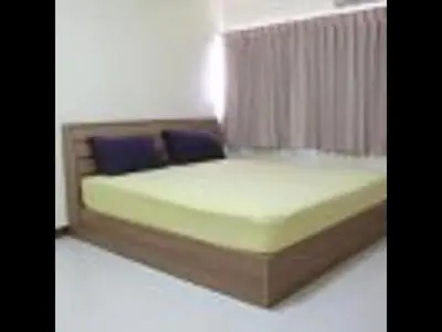 a bed with blue pillows in a room at Popular Palace in Don Mueang Bangkok in Ban Bang Phang