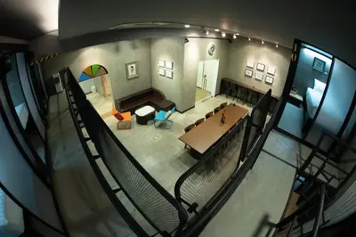 an overhead view of a living room with a table at Third Rock Hostel in Bangkok