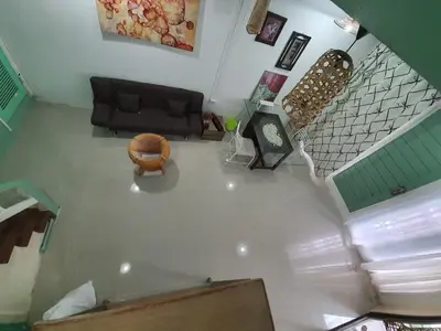 an overhead view of a living room with a couch at บ้านอรุณHome in Bangkok