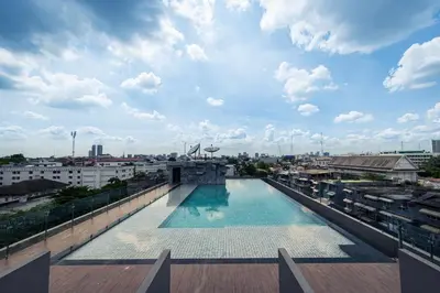 a swimming pool on the roof of a building at Ayathorn Bangkok in Bangkok
