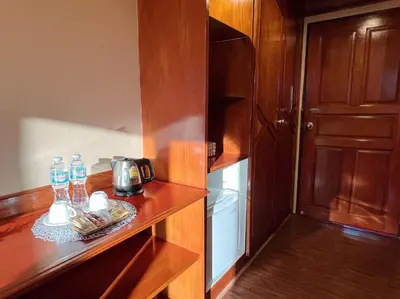 a kitchen with a counter with a coffee maker on it at The Promenade Bangkok in Bangkok