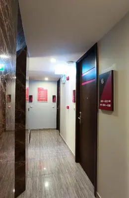 a hallway with a door in a building at Studio Nana by iCheck inn in Bangkok