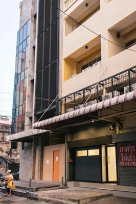 a building with a fire hydrant in front of it at T3 TWO Bedrooms WIFI Full kitchen 1 min to BTS in Bangkok