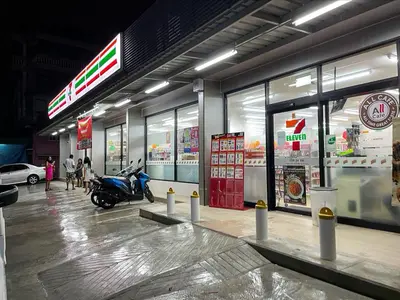 a store with a motorcycle parked inside of it at T3 TWO Bedrooms WIFI Full kitchen 1 min to BTS in Bangkok