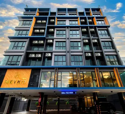 a tall building with a lot of windows at Metro Hotel Ratchada 36 in Bangkok