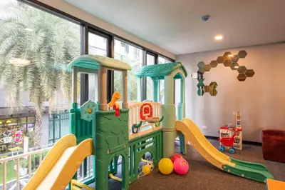 a childs play room with a toy train at Metro Hotel Ratchada 36 in Bangkok