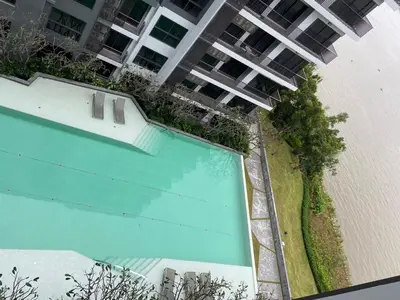 an overhead view of a swimming pool in front of a building at Politan Breeze, Chaophraya River view in Ban Sai Ma