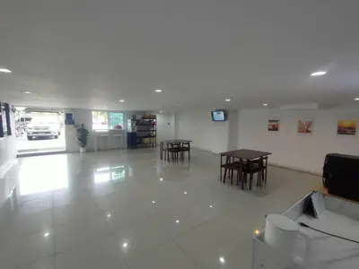 a room with tables and chairs in a building at PRL Place in Bangkok