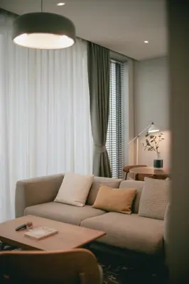 a living room with a couch and a table at humble abode Bangkok Vacation Home in Bangkok