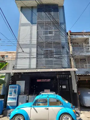 a blue and white car parked in front of a building at BB GuestHouse in Ban Zong Katiam