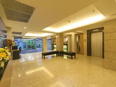 a lobby with a piano in a building at Gateway Hotel Pratunam in Bangkok