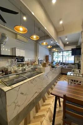 a large kitchen with a large marble counter top at Lemon Siam Hostel Free Breakfast in Bangkok