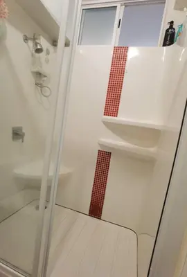 a bathroom with a shower and a sink at Rama9 Cozy Apartment in Bangkok