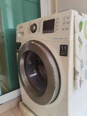 a washing machine sitting next to a window at Rama9 Cozy Apartment in Bangkok