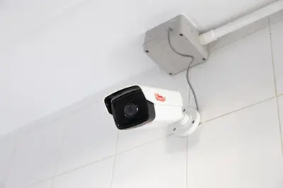 a security camera on a wall in a bathroom at D haus Ngamwongwan Residence in Nonthaburi