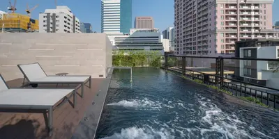 a pool of water on the roof of a building at PASSA Hotel Bangkok in Bangkok