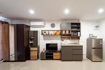 a kitchen with a refrigerator and a counter top at My Space @ Chaosua69 in Ban Pak Khlong Khwang