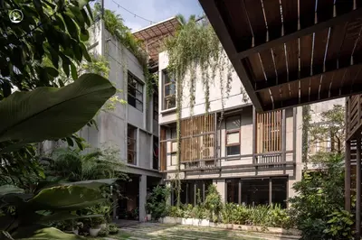 an external view of a building with plants at Tamni in Bangkok