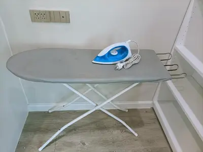 a blue computer mouse sitting on top of a table at Harmony family room in Bangkok