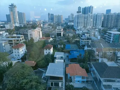 an aerial view of a city with tall buildings at Harmony family room in Bangkok
