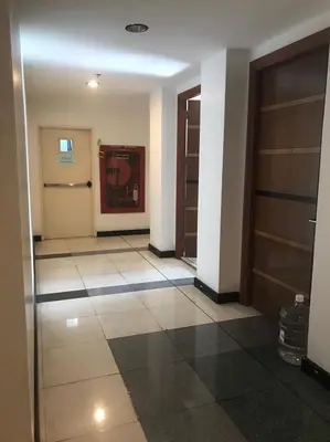 a hallway with two doors and a tile floor at \u6eab\u99a8\u5c0f\u5c4b in Bangkok