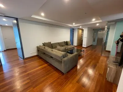 a living room with a couch and a table at ViVi Avenue Thonglor in Bangkok