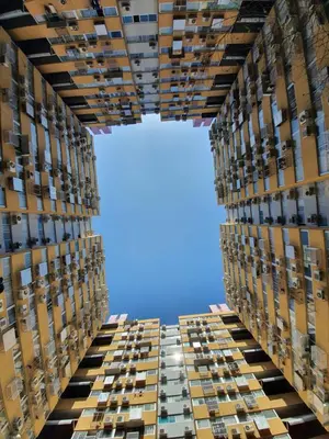 a tall building with a blue sky in the background at Great Location At IMPACT ARENA Muang Thong Thani C3 in Pak Kret