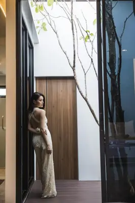 a woman standing in front of a door at VEVILLA in Bangkok