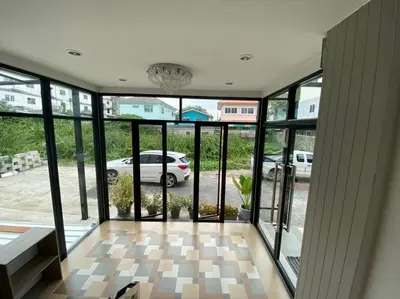a room with a view of a parking lot at Firstbuild Apartment (เฟิร์สบิวท์อพาร์ทเม้น) in Bangkok