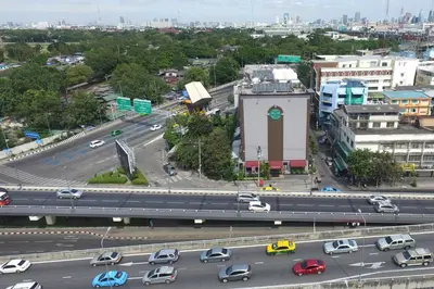 an overhead view of a highway in a city with cars at Bangkok City Suite in Bangkok