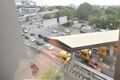 a view of a train station with a busy highway at Bangkok City Suite in Bangkok