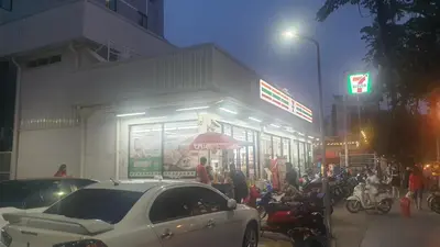 a white car parked in front of a store at W71 in Bangkok