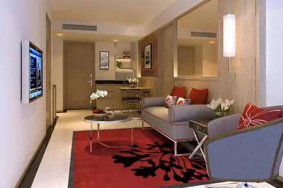 a living room with a couch and a table at FX HOTEL NANA in Bangkok