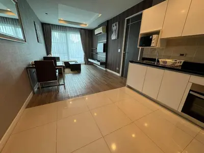 a large kitchen with a dining room and a living room at J Residence Thonglor 8 in Bangkok