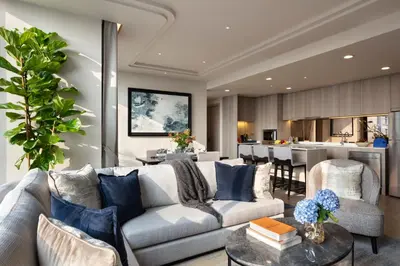 a living room with a couch and a table at Ascott Thonglor Bangkok in Bangkok