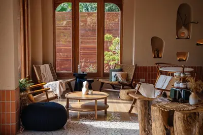 a room with chairs and tables and a large window at VST Punnawithi in Bangkok