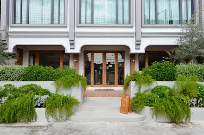 a building with a bench in front of it at VST Punnawithi in Bangkok