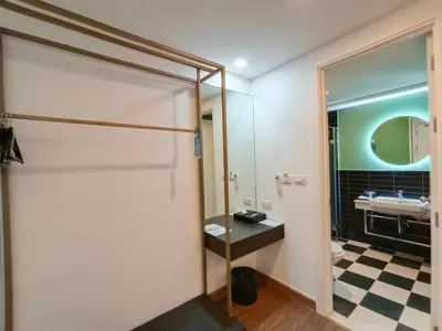 a bathroom with a sink and a mirror at VIVA LA VIDA HOTEL in Bangkok