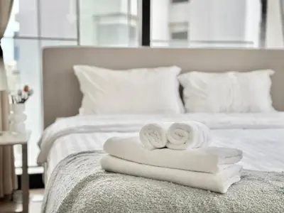 two towels are sitting on top of a bed at Sukhumvit 11#Luxury#Pool#Gym#BTS Nana&MRT Sukhumvit#1BR#Max2ppl in Bangkok