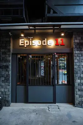 a store front with a sign on the door at Episode 11 Hostel Sukhumvit in Bangkok
