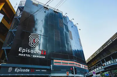 a building with a sign on the side of it at Episode 11 Hostel Sukhumvit in Bangkok