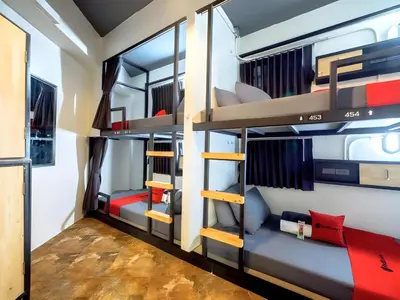 a room with bunk beds in a hostel at Episode 11 Hostel Sukhumvit in Bangkok