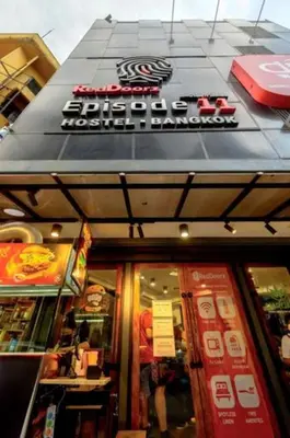 a restaurant with a sign on the front of it at Episode 11 Hostel Sukhumvit in Bangkok