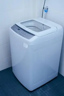 a white toilet in a bathroom with ailed floor at T4 Two Bedrooms Full kitchen/1 min to BTS in Bangkok