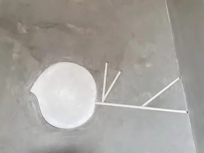 an overhead view of a white toilet with two sticks at Hive28 in Bang Kapi